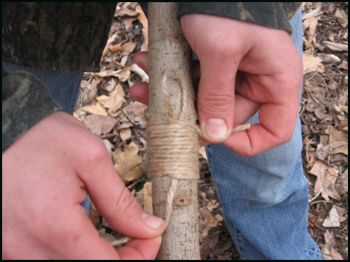 Lashing Now lash the cordage around the sapling about 18 inches or so from the end. This will ensure that the wood does not keep splitting past this point.